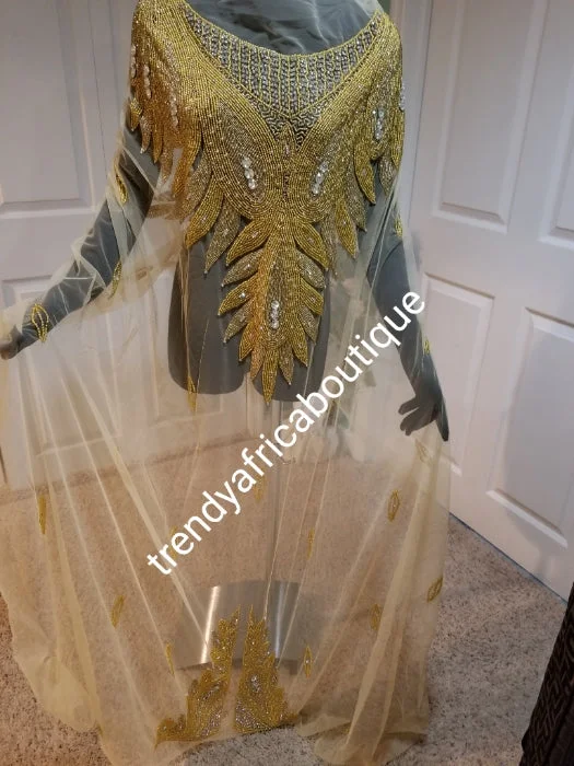 Champagne gold/gold Heavily-beaded net for making modern blouses. Popularly use by Igbo/Delta/edo women for big Occasions. Comes in 1.8yds lenght already design for your beautiful blouse. 1.8yds × 55" width. Satin Long Blouse Champagne gold/gold Heavily-beaded net for making modern blouses. Popularly use by Igbo/Delta/edo women for big Occasions. Comes in 1.8yds lenght already design for your beautiful blouse. 1.8yds × 55" width. Satin Long Blouse