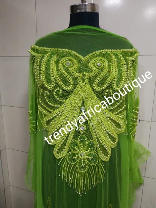 Lemon green Heavily-beaded net for making blouses. Popularly use by Igbo/Delta/edo women for big Occasions. Comes in 1.8yds lenght already design for your beautiful blouse Short Sleeve Blouse
