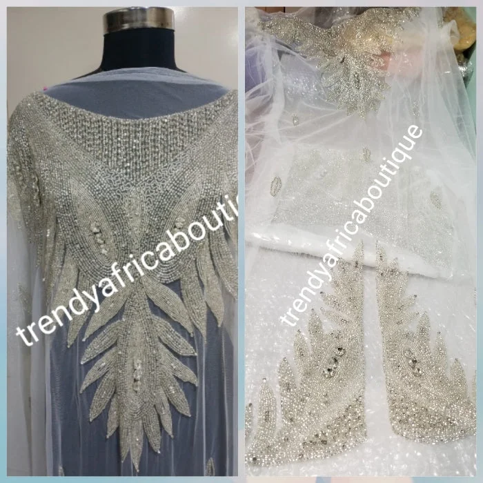 Pure white Heavily-beaded net for making modern blouses. Popularly use by Igbo/Delta/edo women for big Occasions. Comes in 1.8yds lenght already design for your beautiful blouse. 1.8yds × 55" width. Stylish Wrap Blouse Pure white Heavily-beaded net for making modern blouses. Popularly use by Igbo/Delta/edo women for big Occasions. Comes in 1.8yds lenght already design for your beautiful blouse. 1.8yds × 55" width. Stylish Wrap Blouse