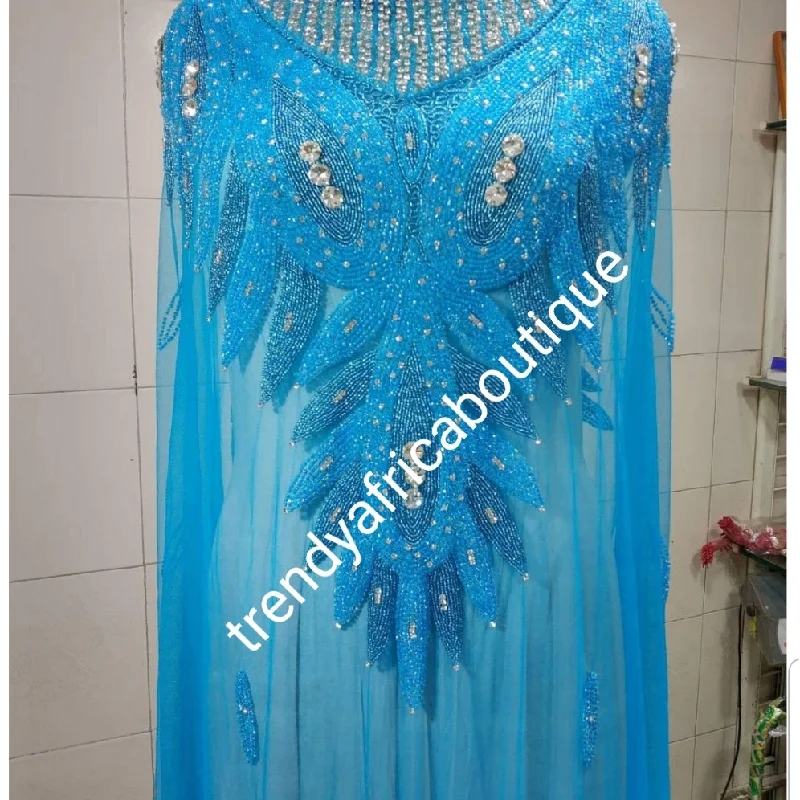 Turquoise blue Heavily-beaded net for making blouses. Popularly use by Igbo/Delta/edo women for big Occasions. Comes in 1.8yds lenght already design for your beautiful blouse Mandarin Collar Blouse